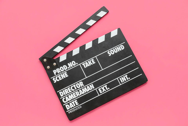 Filmklöppel auf rosa Hintergrund - Foto, Bild