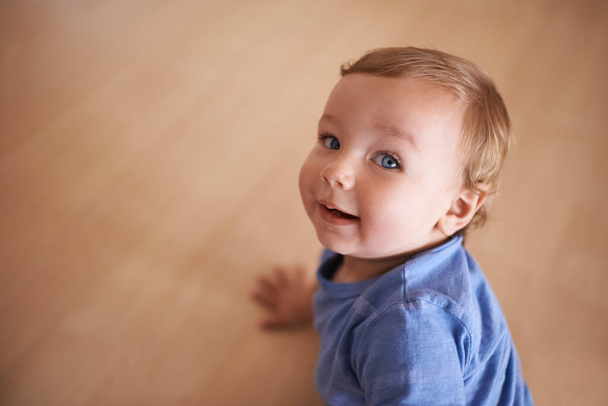 The cutest smile. An adorable infant looking up at the camera - Fotoğraf, Görsel