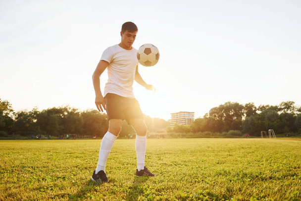 On the sportive field. Young soccer player have training. - Φωτογραφία, εικόνα