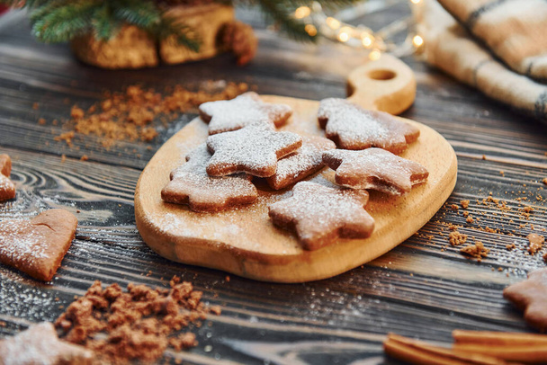 Cookies laying down on the table. Christmas background with holiday decoration. - Foto, Bild