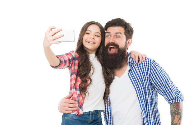 Capture happy moments together. Happy little girl with father. Little child cheerful dad. Father and daughter taking selfie. Teens interests. Technology. Happy family. Sharing ideas and having fun. - Photo, Image