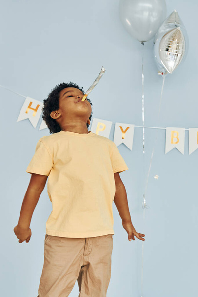 Happy little african american kid have fun indoors at birthday party. - Photo, image
