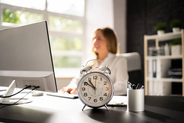 Business Worker Late. Deadline Timer At Desk - Foto, Imagem