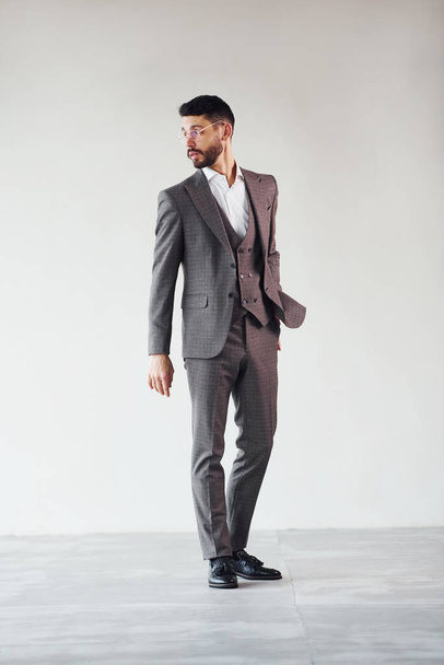 Full length photo of young stylish businessman that is in suit indoors. Conception of success. - Foto, Bild