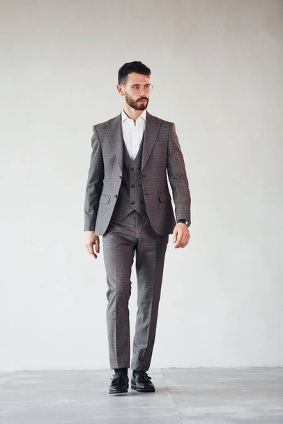 Full length photo of young stylish businessman that is in suit indoors. Conception of success. - Foto, Imagen