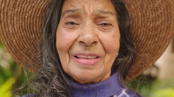 Happy senior woman, retirement portrait and park, garden or nursing home outdoors for wellness, healthy fresh air and mental health. Elderly, old and smile retired pensioner lady face relax outdoor. - Filmagem, Vídeo