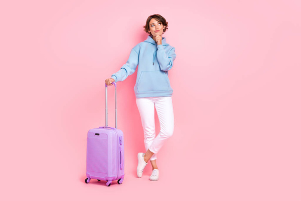 Full length photo of minded lady look empty space hmm consider choose which country excursion visit isolated on pink color background. - Фото, зображення