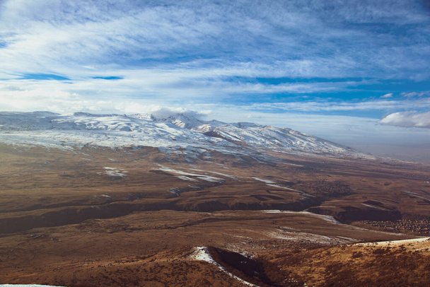 snowy Aragats mountain in Armenia  under sky - Valokuva, kuva