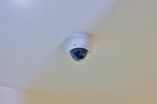 Online Security CCTV camera surveillance system indoor of house. Real time Modern CCTV camera on a pole. Equipment system service for safety life or asset. - Photo, Image