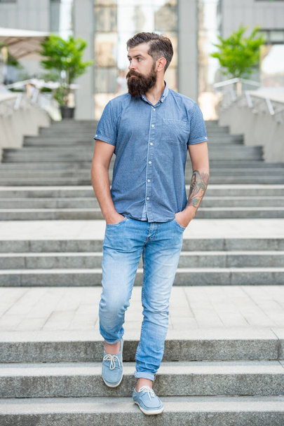 bearded man walk downstairs. full length of bearded man with beard. hipster bearded man outdoor. - Zdjęcie, obraz