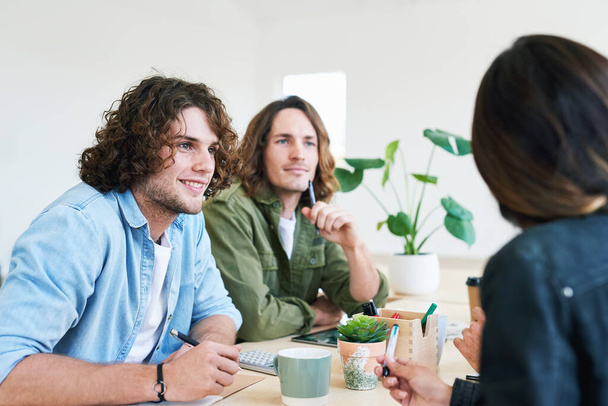 Startup business meeting, communication and teamwork collaboration from young team working on success strategy. Planning, marketing and gen z men and woman brainstorming advertising idea together. - 写真・画像