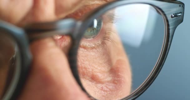 Vision, eyes and zoom of elderly eye man with glasses thinking, stress and sad with mental health or anxiety over memory. Portrait, face and old male with burnout or depression and serious look - Footage, Video