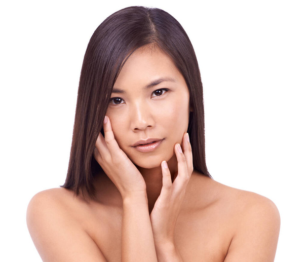 Silky smooth skin. a beautiful young oriental woman against a white background - Fotoğraf, Görsel