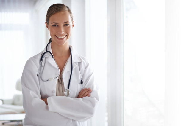 Put your trust in her. Portrait of an attractive young doctor standing with her arms folded - Photo, Image