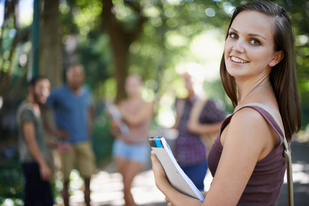 I love university life. Portrait of an attractive young woman on campus - Foto, afbeelding