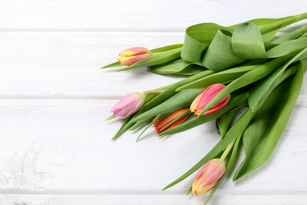 Colorful tulips on wooden board. Graphic resources - Photo, Image