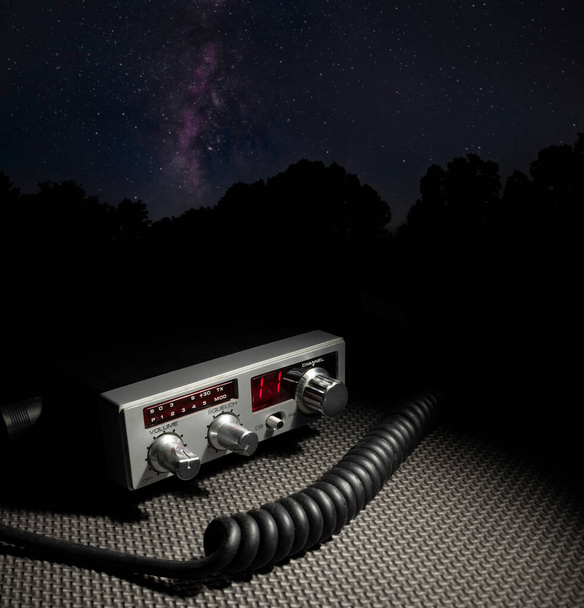 Two way radio with microphone cord and Milky Way behind at night - Foto, Imagem
