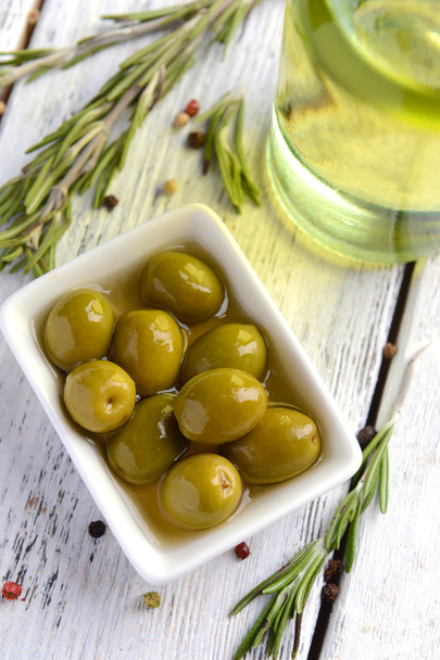 Marinated olives on table - Фото, зображення