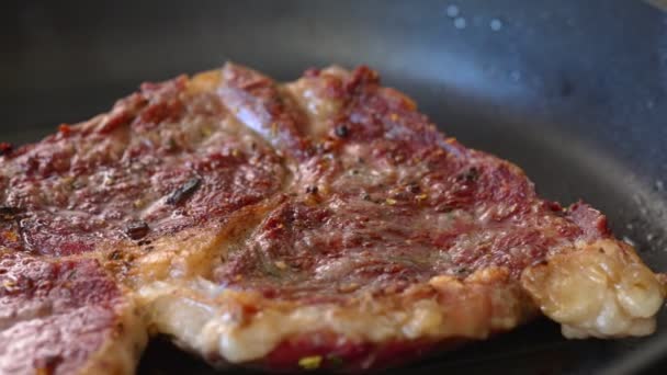 Beef entrecote is fried in a pan. - Footage, Video