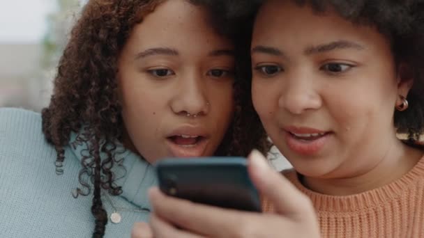 News, wow and friends with phone reading social media, discount and internet story. Black women with an 5g mobile smartphone texting a contact and look at a online deal, sale or a shopping website. - Footage, Video
