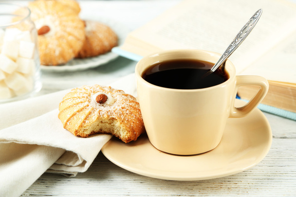 Cup of coffee with tasty cookie - Photo, image