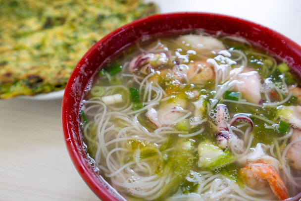 Seafood rice noodle soup bowl - 写真・画像
