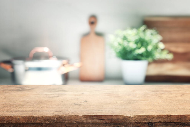 empty table board and defocused modern kitchen background. product display concept - Fotó, kép