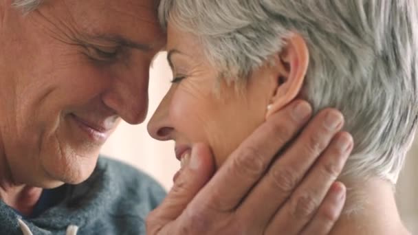 HE18-09-A1-092. A senior couple, love and touch face in intimate moment of happiness. Zoom of elderly man with woman in retirement, have happy time and laugh about nostalgia memory together - Footage, Video