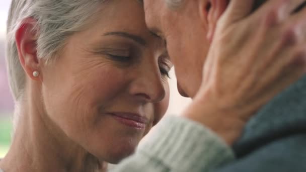 Love, couple and retirement with a senior woman and man hugging in their home with trust, care and safety. Affection, romance and together with an elderly female pensioner and her husband in a house. - Footage, Video