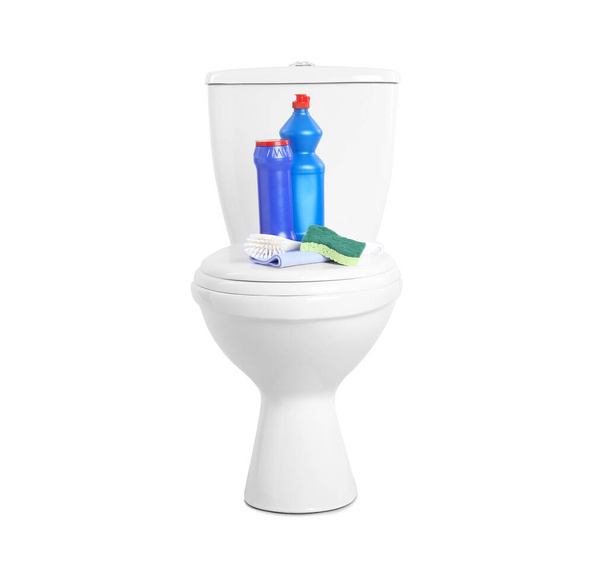 Different cleaning supplies on toilet bowl against white background - Photo, Image
