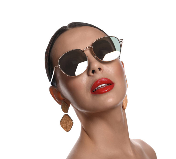 Attractive woman in fashionable sunglasses on white background - Fotó, kép
