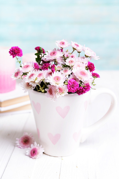 Beautiful flowers in cup - Zdjęcie, obraz
