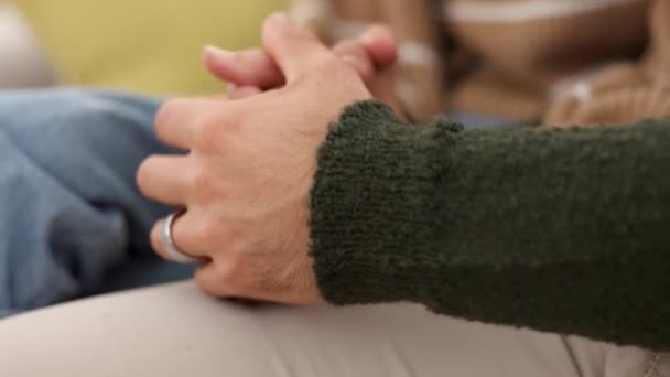 Support, love and care couple holding hands for depression, mental health problem or job fail news.. Bizalom, segítség a férfi vigasztaló depressziós, szomorú partner nő nehéz időkben együtt és közelről. - Felvétel, videó