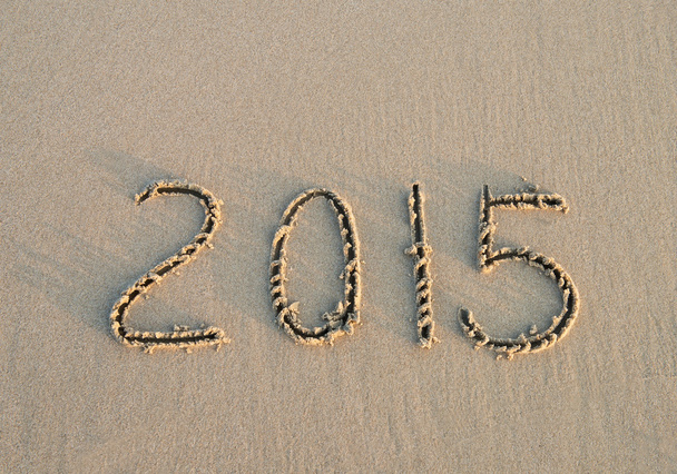 Jaar 2014 hand geschreven op het zand - Foto, afbeelding