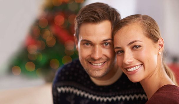 Christmas couple. Portrait of a happy young couple on Christmas day - Photo, Image