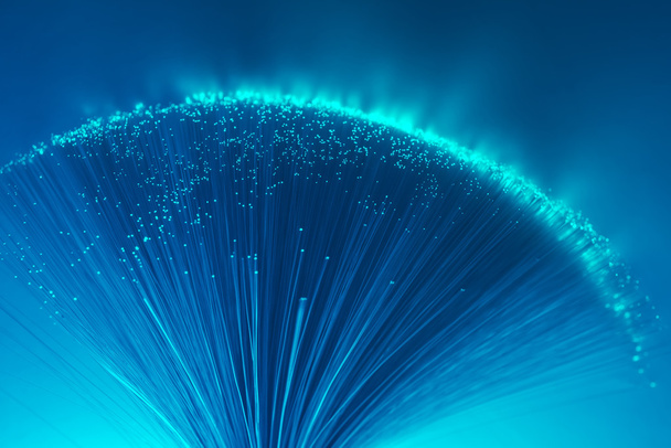 optical fibres dinamic flying from deep on technology background - Φωτογραφία, εικόνα