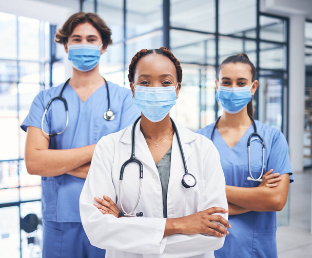 Team of medical doctors, covid hospital healthcare response and cardiology staff diversity. Corona virus disease clinic, young professional nurse and proud expert surgeon in protection face mask. - Photo, Image