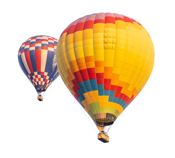 Twee hete lucht ballonnen geïsoleerd op een witte achtergrond. - Foto, afbeelding