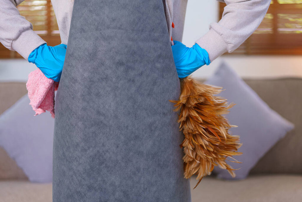 Hygiene cleaning concept, Housemaid is hold feather duster and cloth to prepare cleaning the house. - Valokuva, kuva