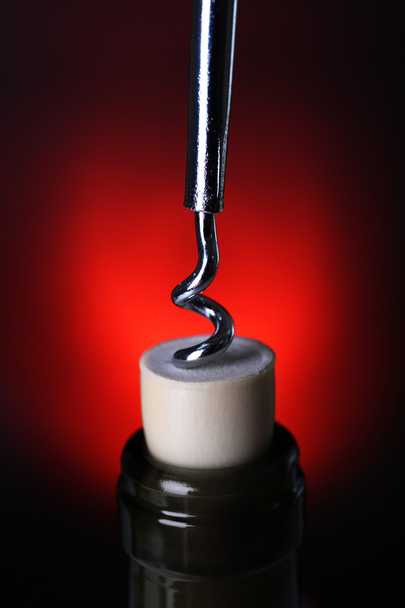 Bottle opener close-up, on dark color background - Photo, Image