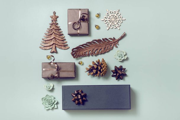 Christmas New Year flatlay with gifts and holiday decor top view. Creative modern layout. Christmas knolling - 写真・画像