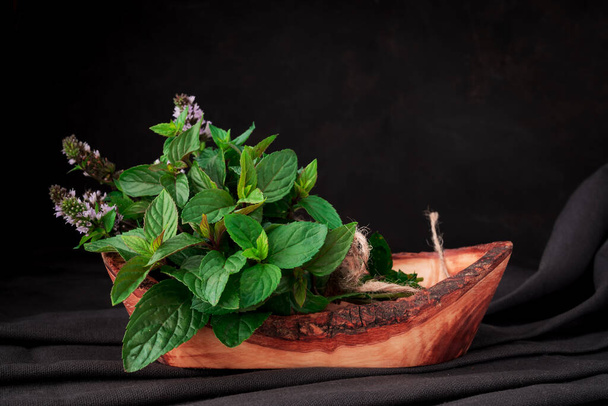 Fresh garden peppermint. Bunch of mint on table.  - Photo, Image