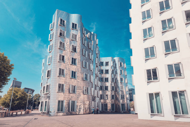 23 July 2022, Dusseldorf, Germany: Gehry Bauten or Zollhof unusual modern architecture buildings in Media Harbor. Dancing houses and travel attractions - 写真・画像