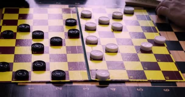 trainer tells the student the combinations of international draughts on the draughts board, the game of combinations in draughts - Footage, Video