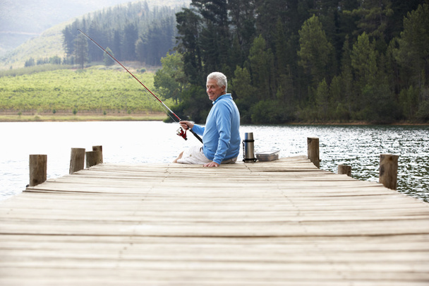 Senior man fishing - Foto, Bild