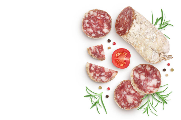 Cured salami sausage slices isolated on white background. Italian cuisine with full depth of field. Top view with copy space for your text. Flat lay - Foto, Imagem