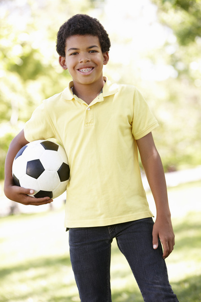 Boy holding football ball - Фото, зображення