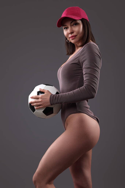 young woman with soccer ball on black background - Foto, immagini