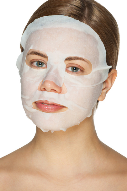 Woman applying facial mask  - Valokuva, kuva