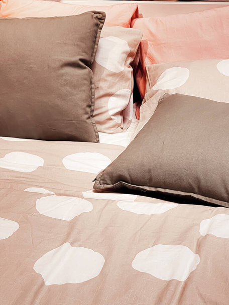 Modern style bedding on bed in bedroom, interior design detail - Φωτογραφία, εικόνα